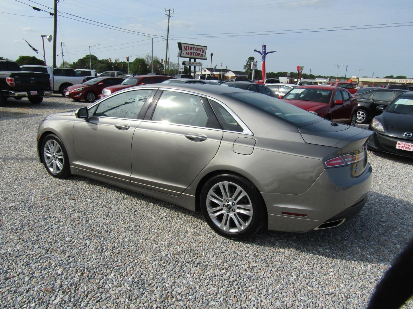 2015 Silver /Tan Lincoln MKZ FWD (3LN6L2GK9FR) with an 3.7L V6 DOHC 24V engine, Automatic transmission, located at 15016 S Hwy 231, Midland City, AL, 36350, (334) 983-3001, 31.306210, -85.495277 - Photo#5